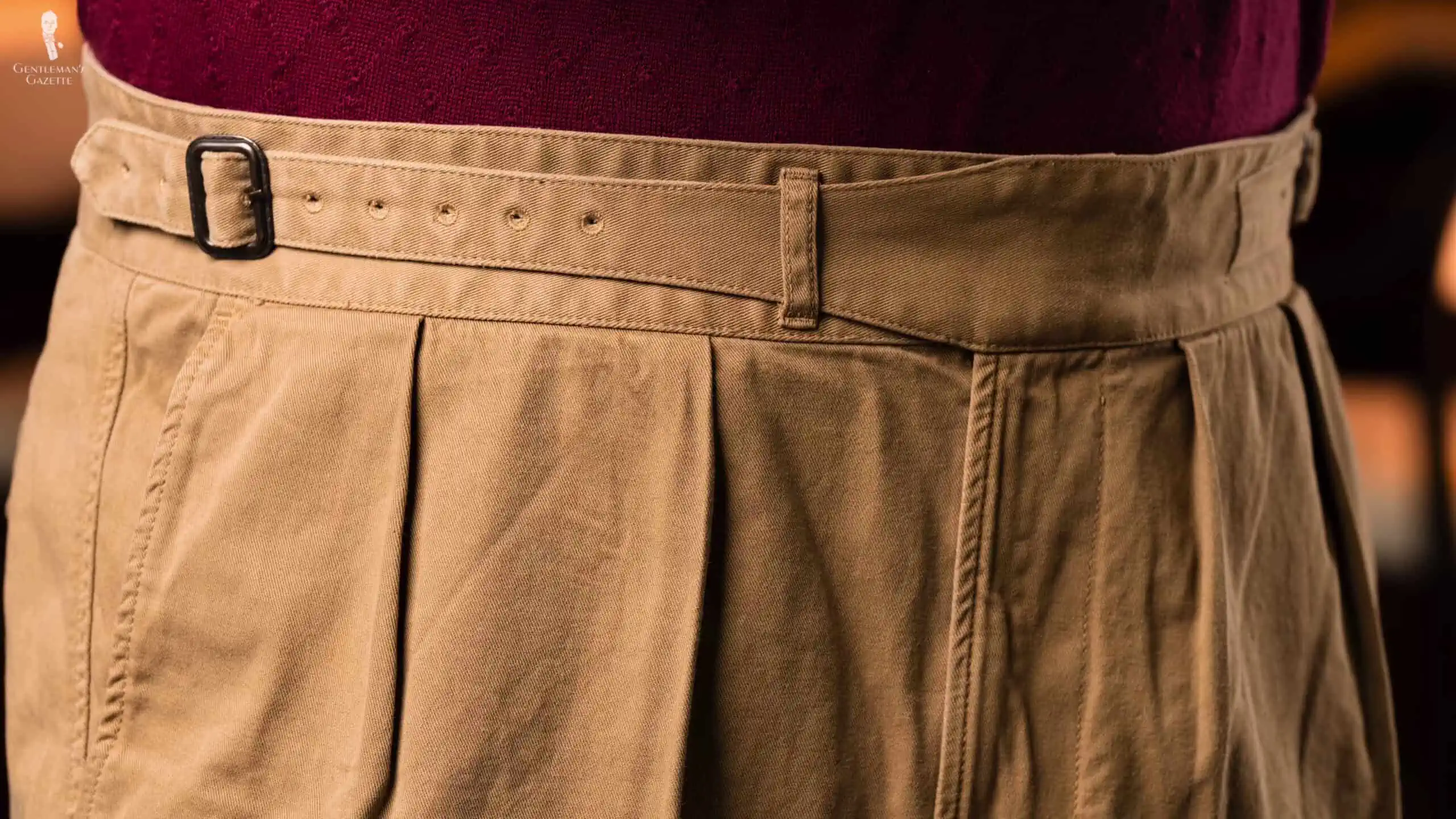 Single extended waistband Gurkha trousers with metal buckle for adjustments.