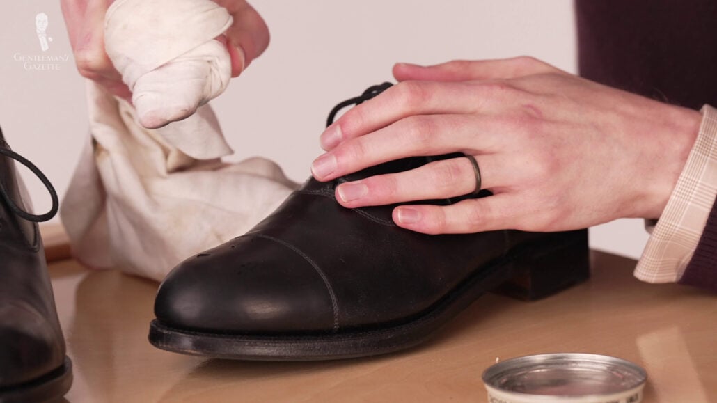 The occasional drop of water can help allow you to work more comfortably, aids in emulsification, and prevents friction between the cloth and the shoe.