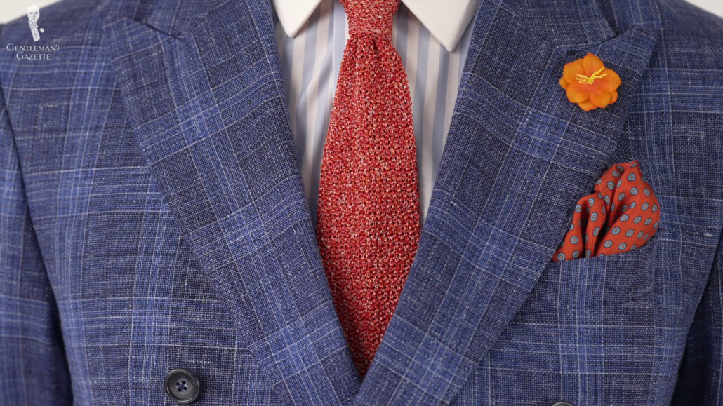 Red knit tie made from silk fiber threads.