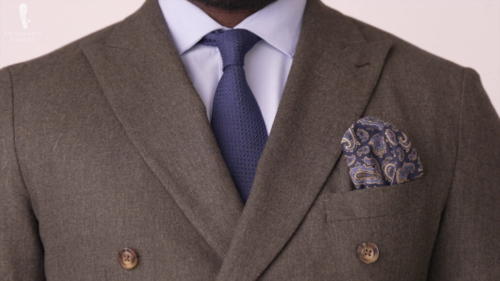 Kyle is in a brown tweed blazer, navy blue grenadine tie, and navy blue pocket square. Grenadine Silk Tie in Navy Blue - Fort Belvedere