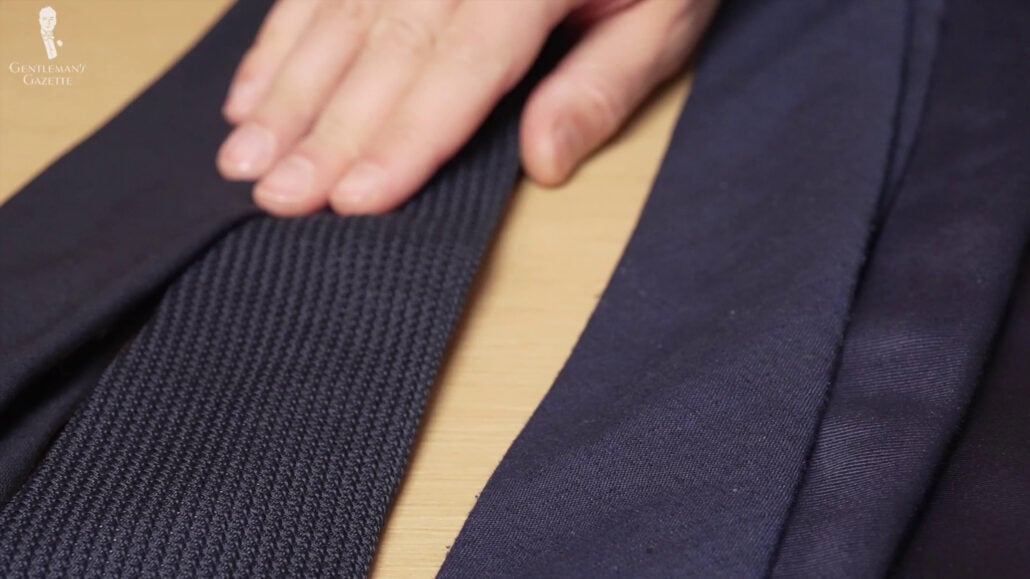 A navy grenadine weave provides a unique texture.