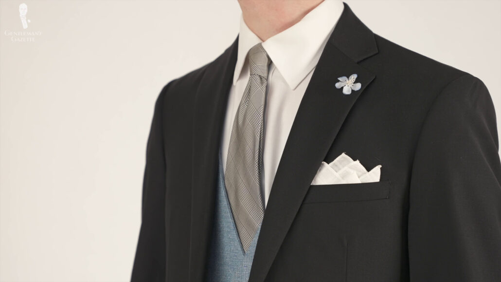 Wedding tie-on classic black suit ensemble with white pocket square, and boutonniere. Prince of Wales Check Silk Tie in Black and White - Fort Belvedere