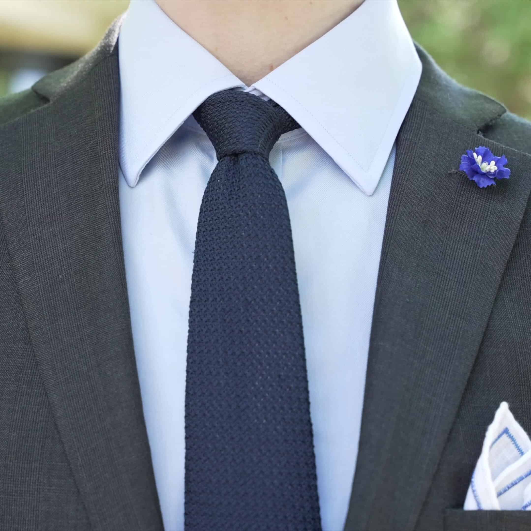 A navy blue grenadine tie can be used for attending funerals.