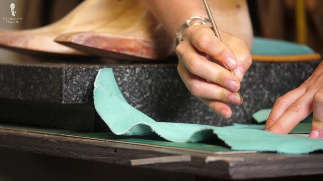 Amara cuts the leather slightly wider in the footbed to ensure that everything is overlapping properly and there are no gaps.