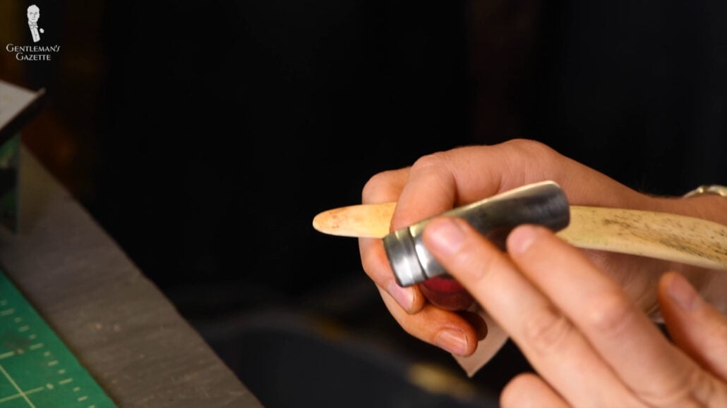 Amara Ensures That The Hammer Tool Has The Right Temperature With Her Finger Amara ensures that the hammer tool has the right temperature with her finger.