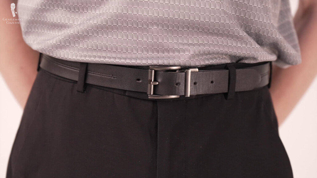 Belt shown center screen with black pants and white shirt