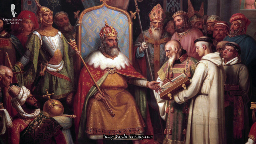 King Charlemagne sitting on his throne surrounded by his court.