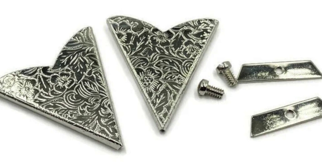 Decorative metal Collar Tips for western and rockabilly shirts made of silver and metal with cowboy motifs, stones, and filigrees.