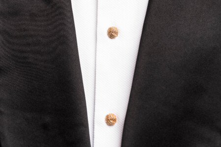 Photo of shirt front displaying gold studs