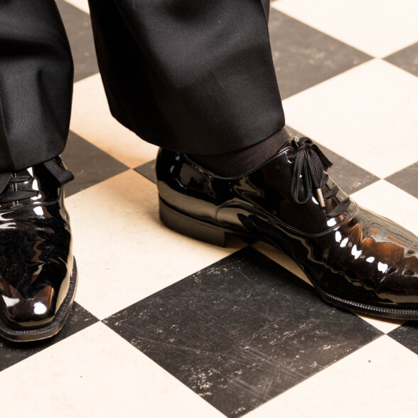Photo of patent leather oxfords worn with a pair of evening socks