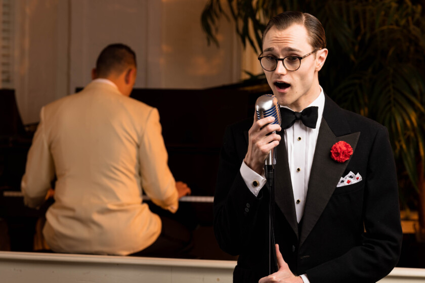 Photo of Preston singing while in Black Tie