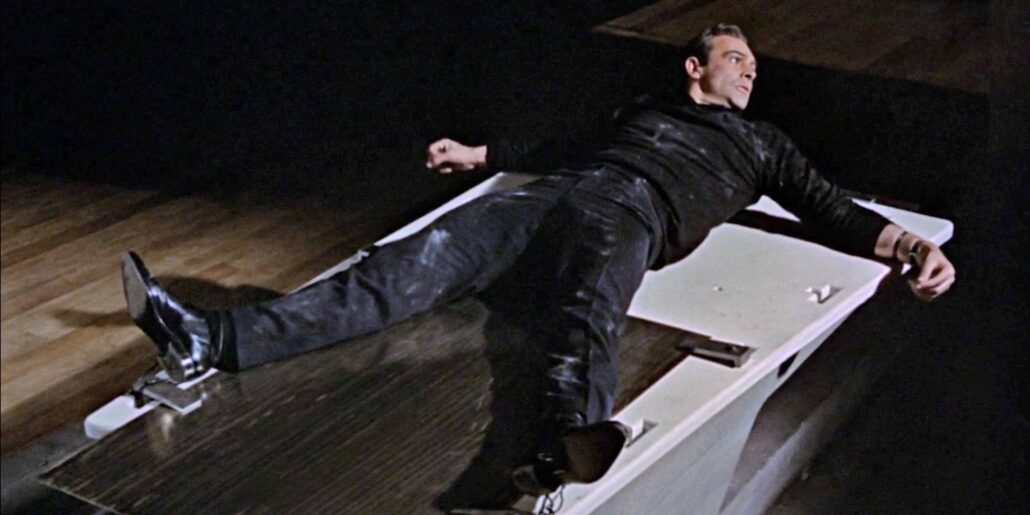 The famous laser table scene in Goldfinger prominently showcases a pair of Chelsea Boots