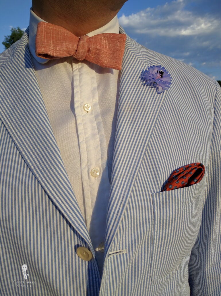 Photo of a seersucker jacket worn with warm weather accessories