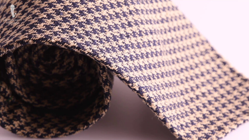 The burette silk tie has more volume and a formal color palette.