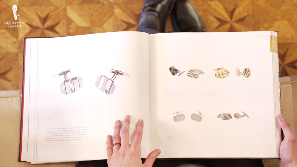 A book showing some expensive cufflink faces.
