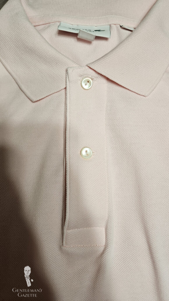 Photo of Lacoste polo shirt with two pearl buttons