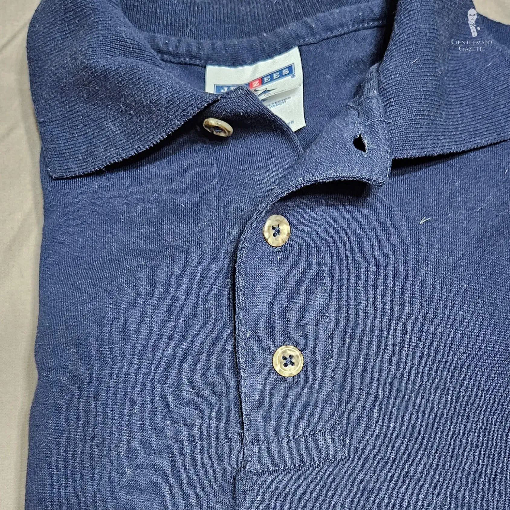 Photo of Navy polo shirt with basic placket
