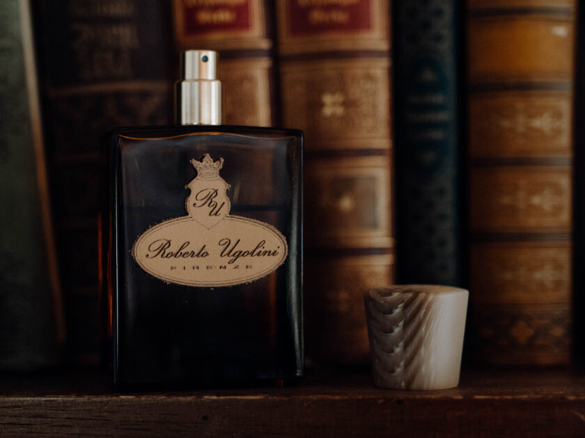 Photo of Roberto Ugolini Oxford fragrance styled in front of leather books