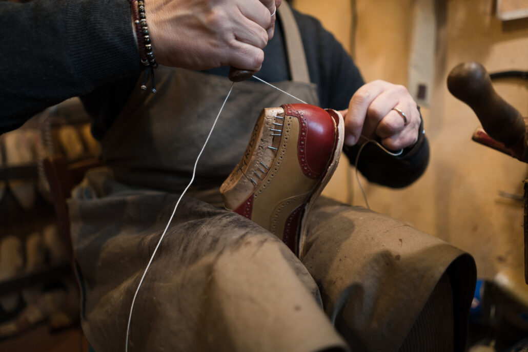 Photo of a man making a shoe