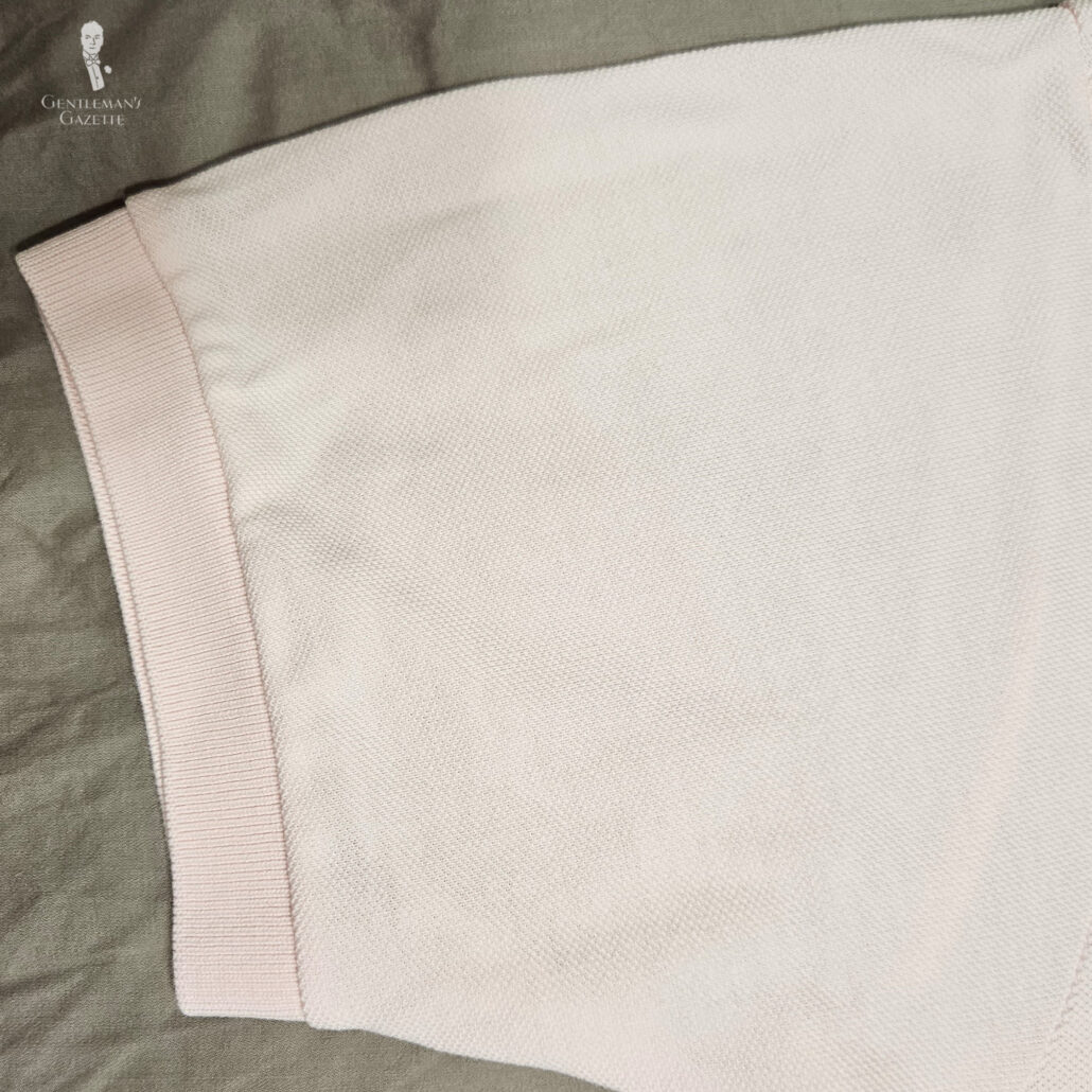 Photo of Rouched cuff on a pink cotton pique polo shirt
