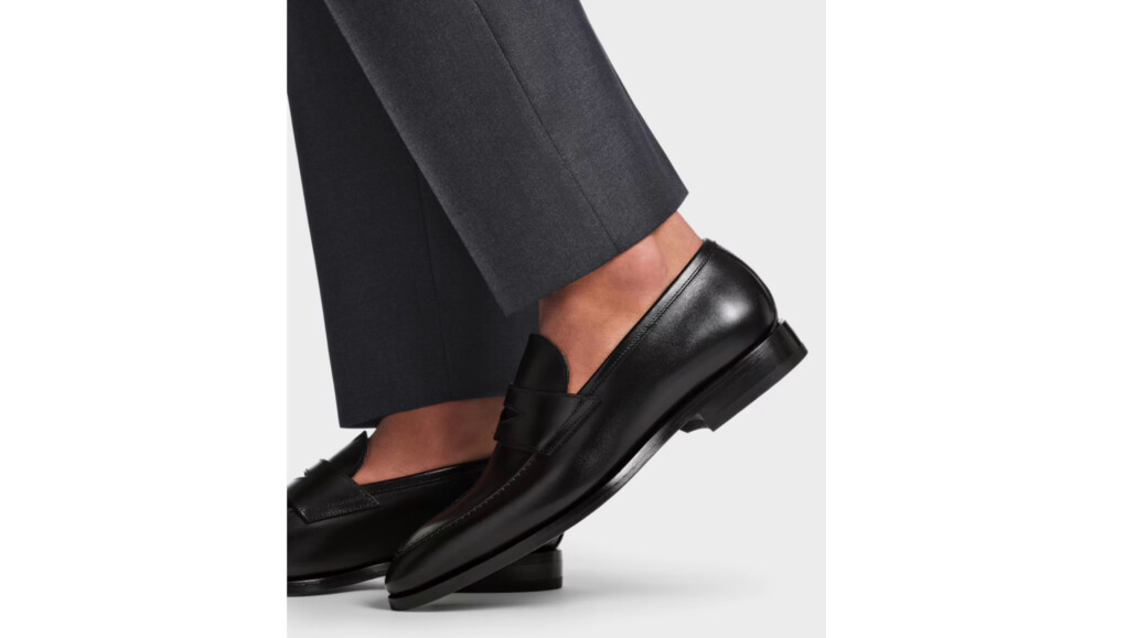 Suitsupply shoes run larger and will fit well on a wider foot.