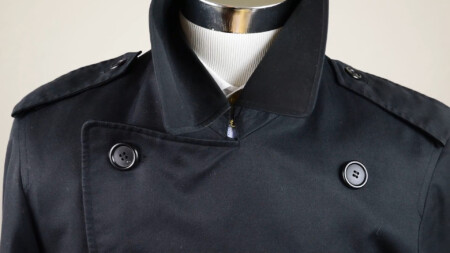 The hooked throat closure keeps the trench coat held against the elements