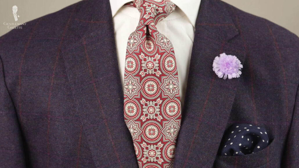 The red and ivory color pattern works well with navy business suits.