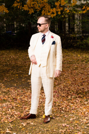Photo of a man in a white suit