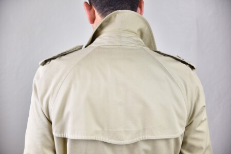 You can see the diagonal sleeve heads of the Raglan sleeve on the back of this trench coat