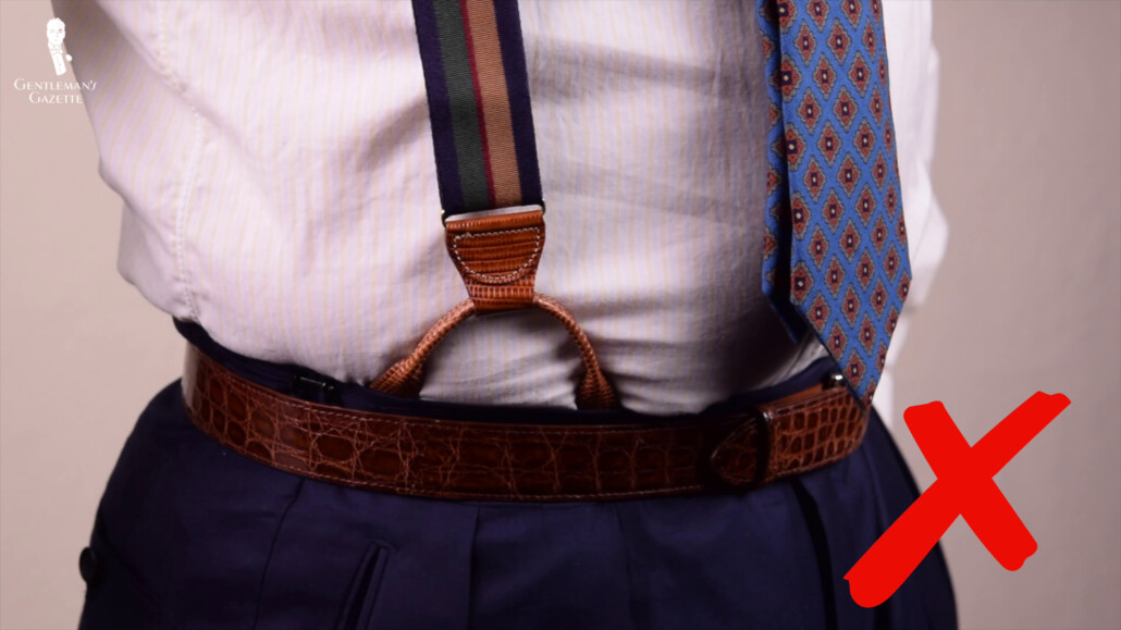 suspenders being worn with a belt