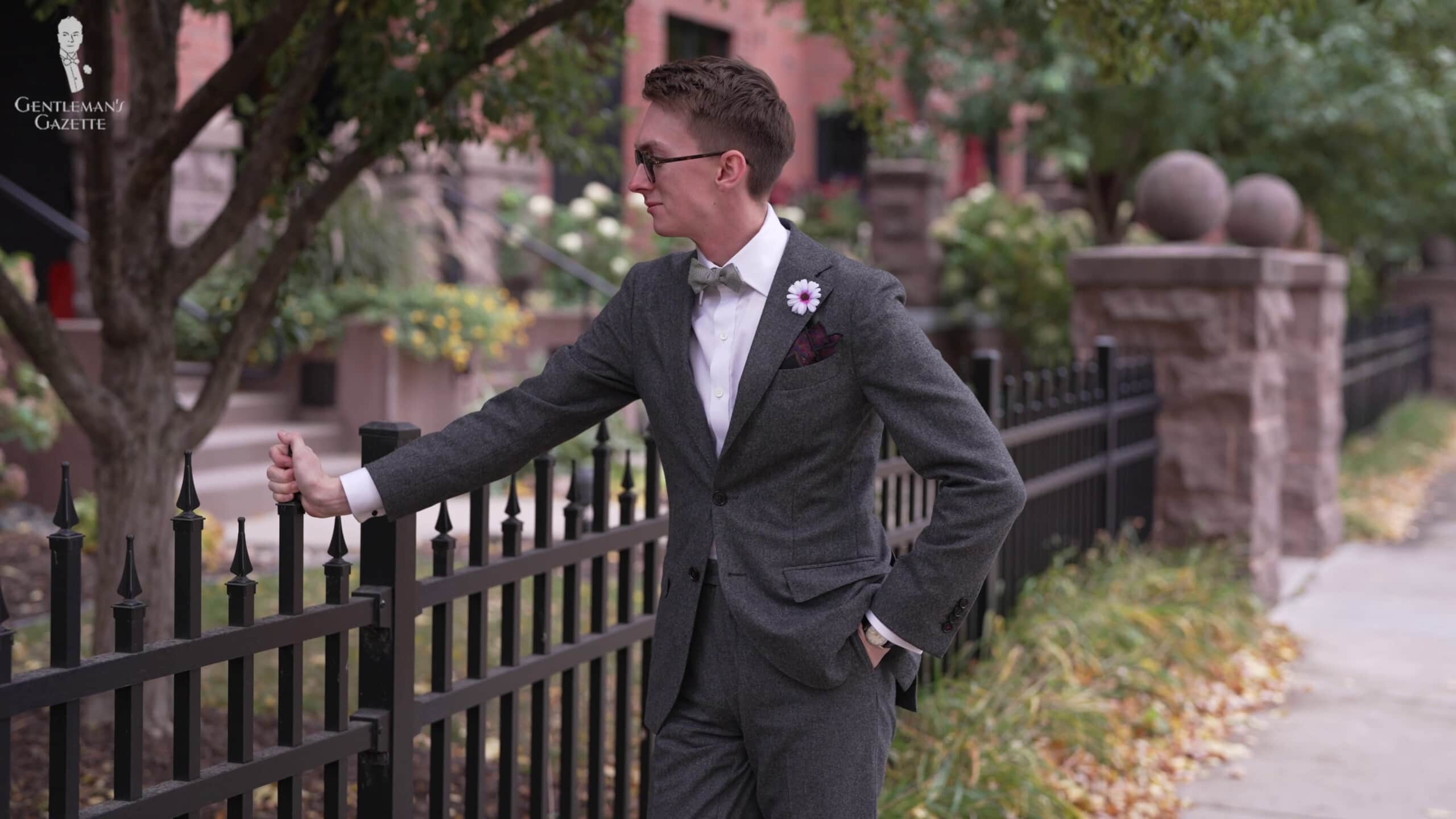 Jack holding a fence and being himself