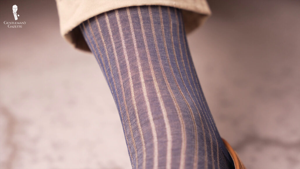 A classic pair of navy and khaki colored socks appropriate for office.