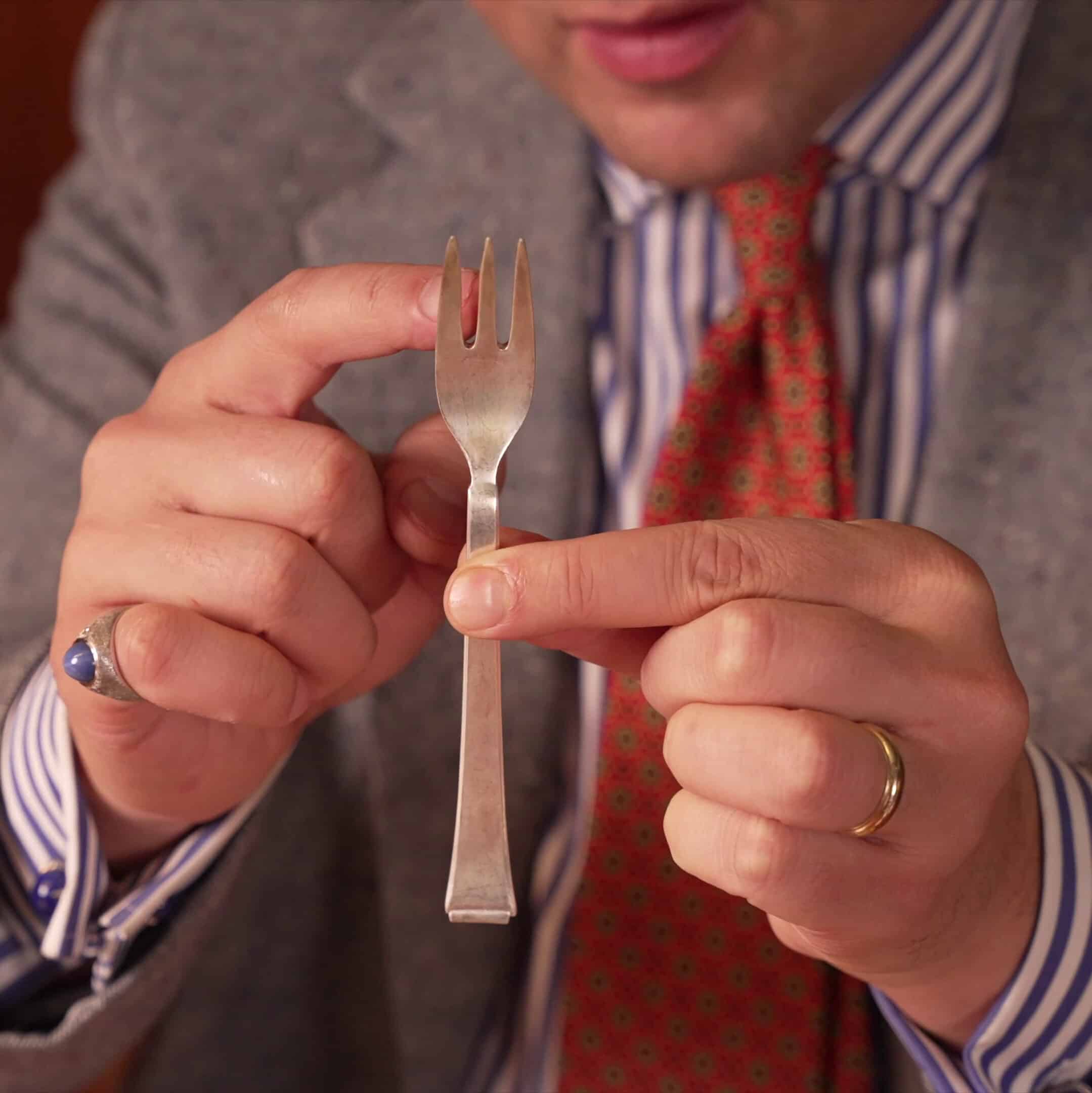 A special fork designed for pastry desserts.