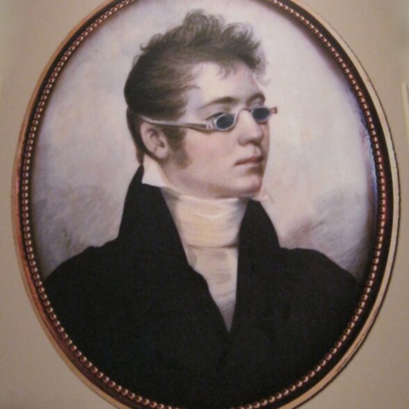 Painting of a man in early 19th century garb wearing spectacles with blue lenses