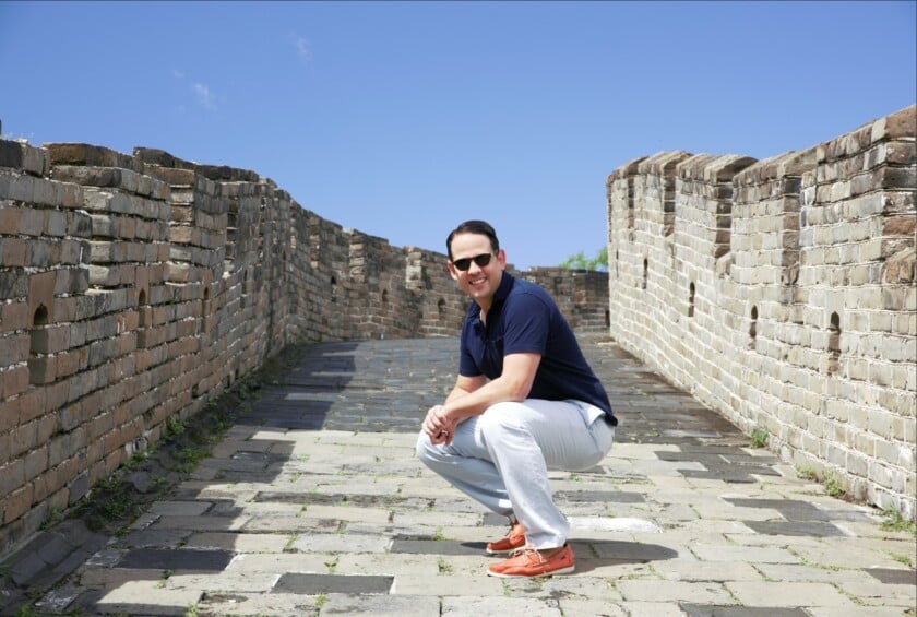 Raphael Wears Sunglasses Polo Shirt Cotton Trousers Boat Shoes On The Great Wall Of China Photo of Raphael wearing sunglasses on the Great Wall of China