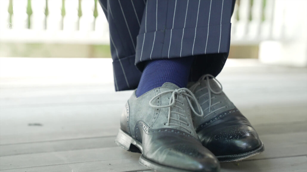 Sporting a patterned suits looks well with a solid dress socks.