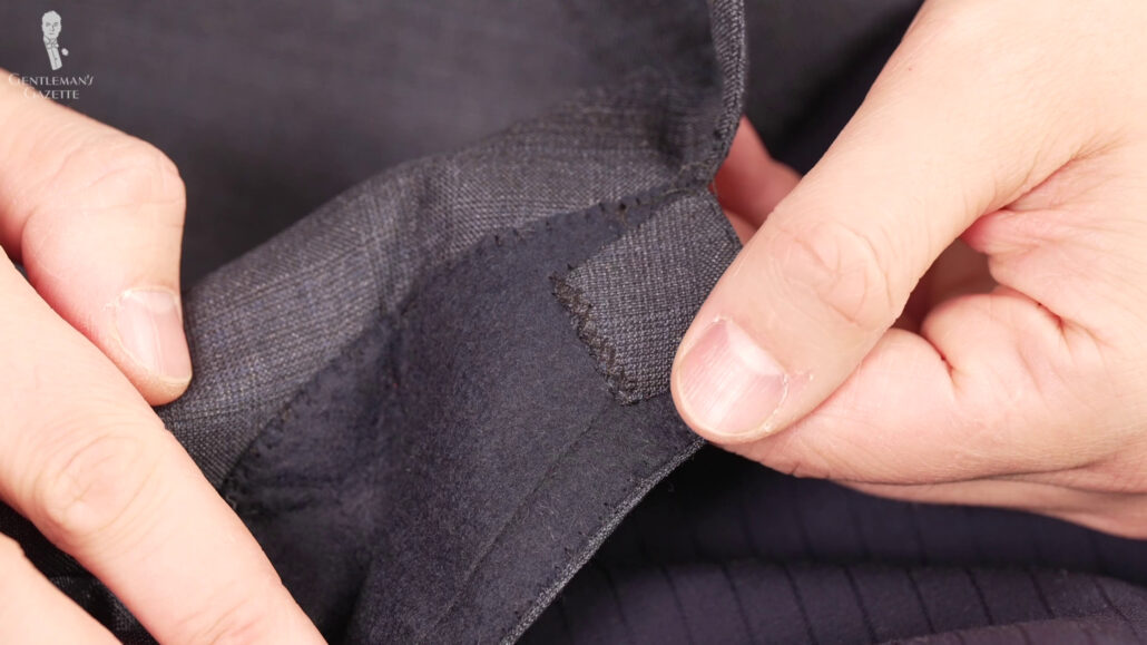 The irregular stitching is a sign that this was sewn by hand.