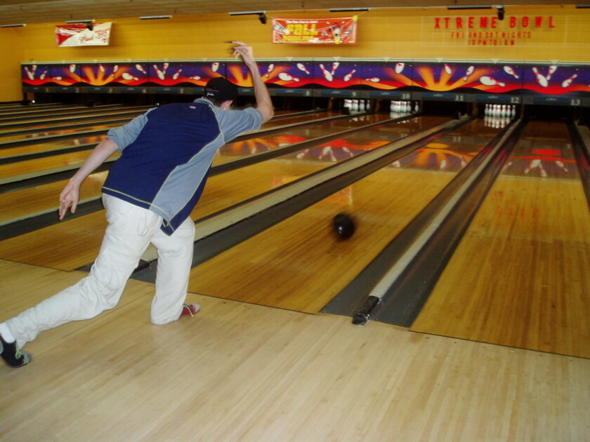 Photo of a man bowling 