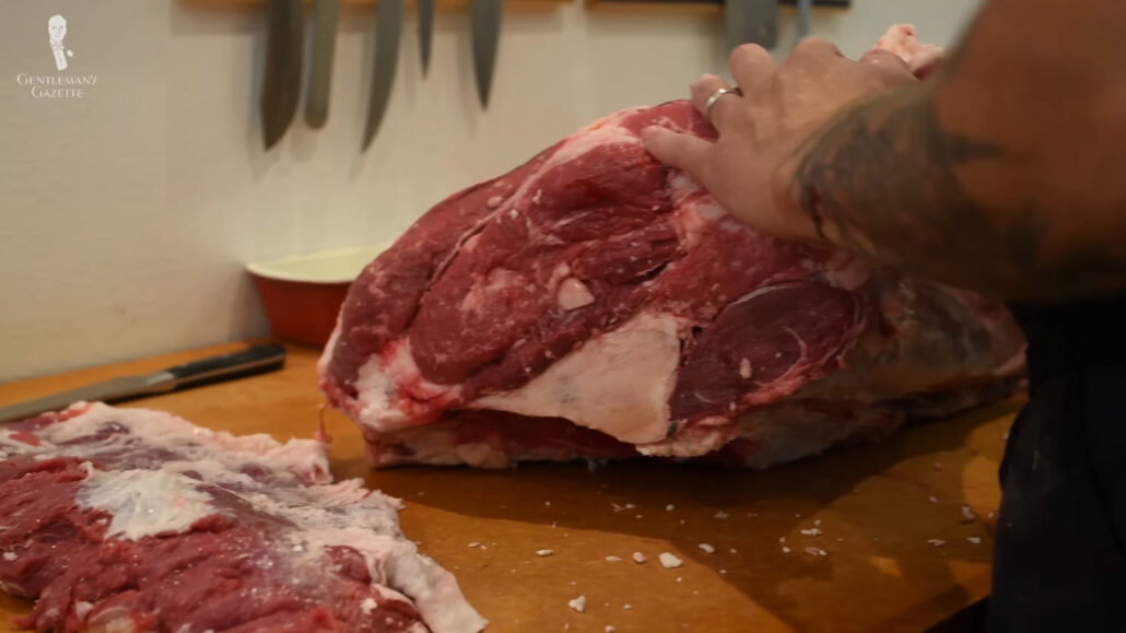 Photo of a Butcher preparing a cut of steak