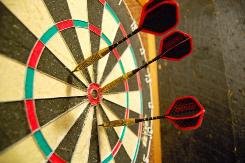 Darts In A Dark Board Image Credit Wikimedia Photo of darts in a dart board