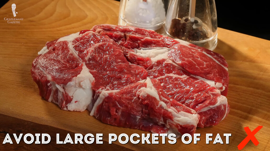 Photo of large pockets of fat on steak