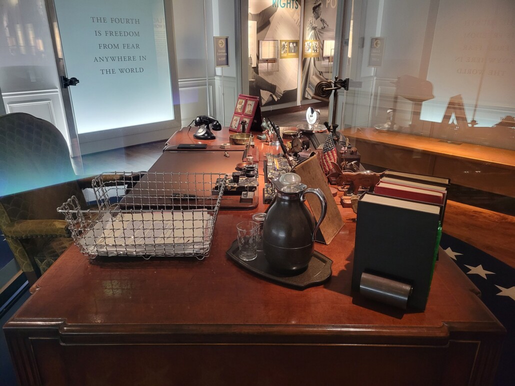 Many classic desktop decor items, including a paper tray, on the desk of President Herbert Hoover