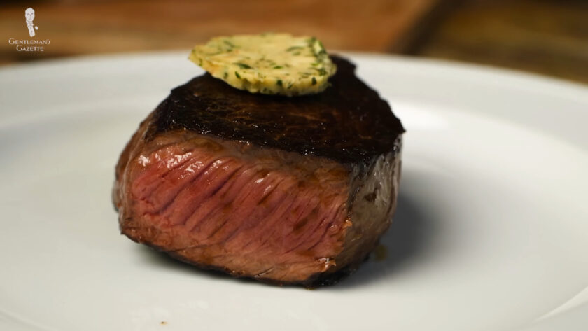 Photo of plated steak with garlic butter