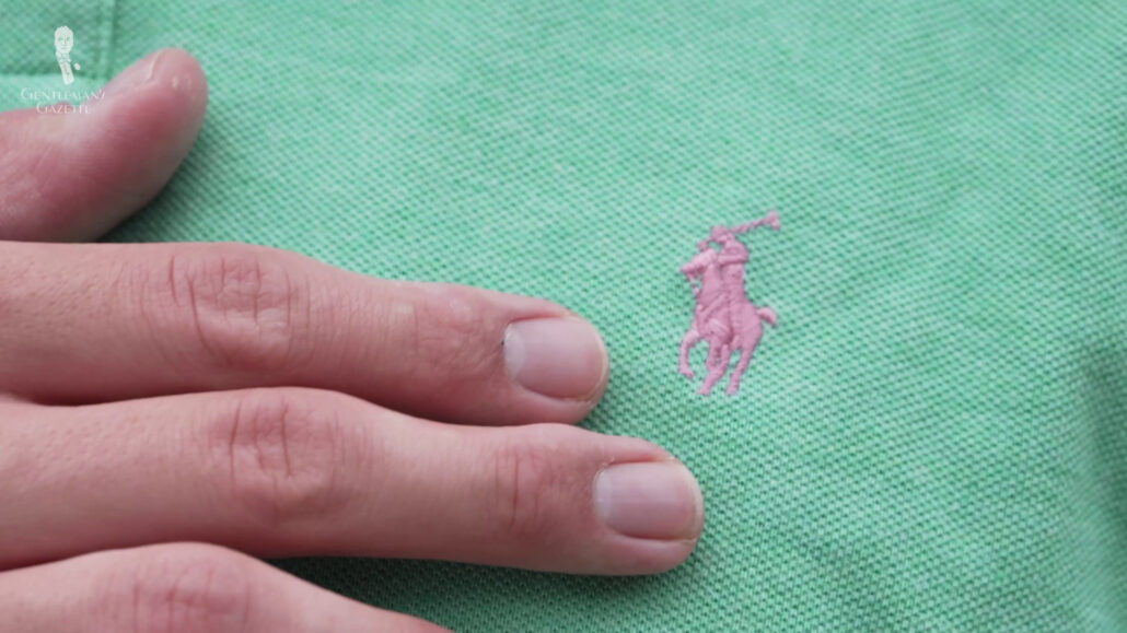 The polo player logo stitched onto the chest of a Ralph Lauren polo shirt.