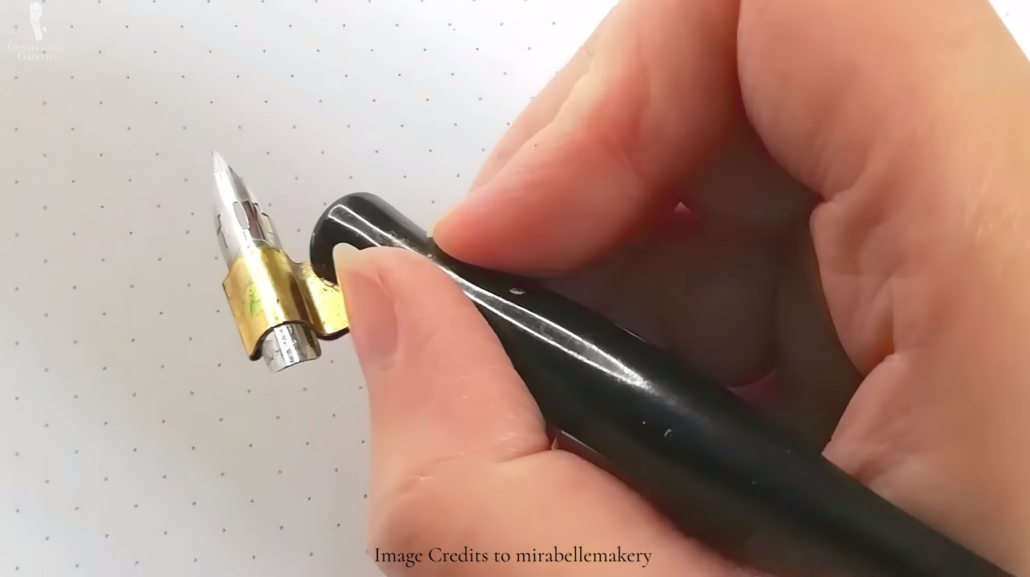 Using a black and gold calligraphy fountain pen.