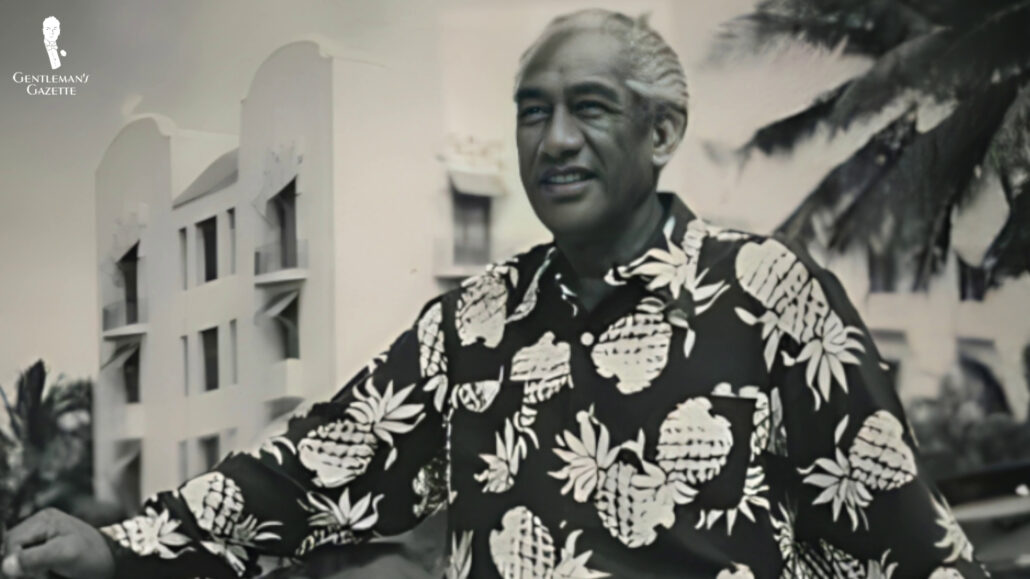 A black and white photo of a local wearing a Hawaiian shirt