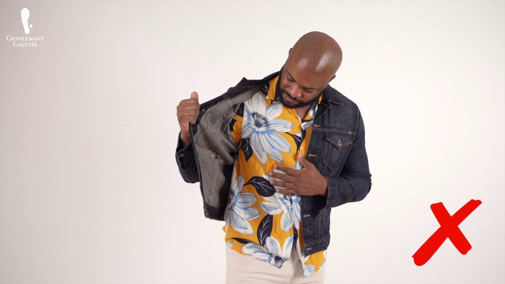 Kyle realizing it might not be a good idea to pair Hawaiian shirts with  denim Jackets