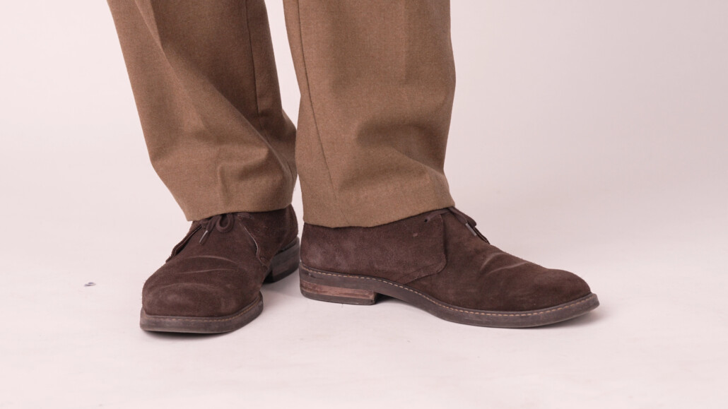 Photo of Chukka boots worn with caramel trousers