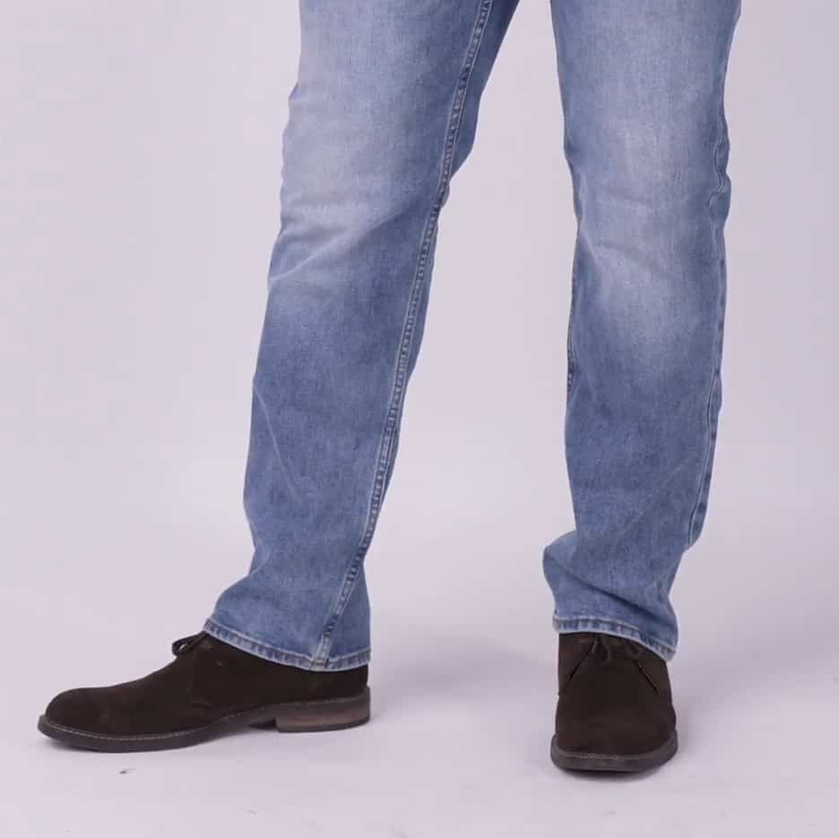 Photo of Chukka boots worn with light blue wash denim jeans