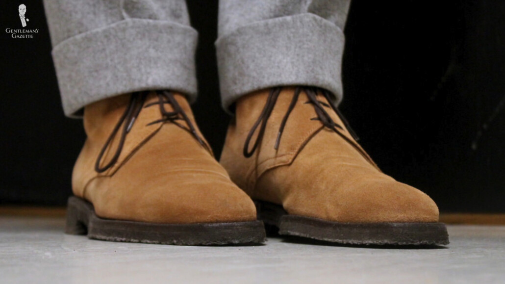 photo of Chukka boots worn with light gray trousers